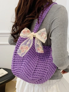Chic purple woven tote bag with delicate white lace bow and floral embroidery detailing