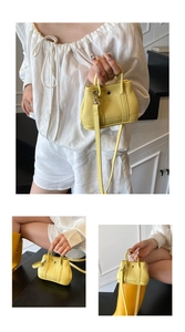 Detail of a bright yellow lychee texture mini tote bag with silver studs and a shoulder strap