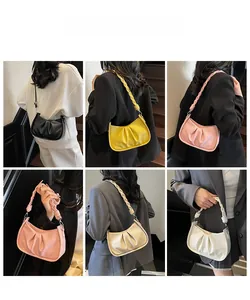 Detailed view of women pleated hobo bag showing woven handle and multiple color options