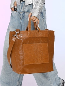 Brown crocodile texture tote bag with skull embossing and silver metal hardware