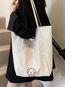 White canvas tote bag with red dog embroidery and large capacity for daily commuting