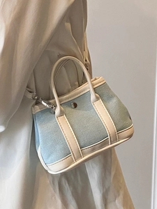 Minimalist light blue lychee pattern mini handbag with cream handles and shoulder strap