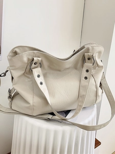 Minimalist beige PU leather large tote bag with top handles and adjustable shoulder strap