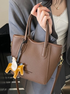 Litchi texture dark brown bucket handbag with horse charm and crossbody strap