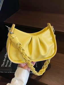 Lemon yellow pleated underarm bag with unique woven shoulder strap in PU leather
