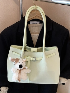 Chic mint green minimalist tote bag for women with a cute white plush bear charm accessory