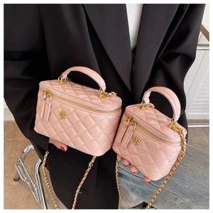 Detailed comparison of pink quilted vanity bags in large and small sizes with gold chains