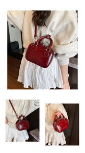 Detailed close-up showing the glossy leather texture and RETRO embossed design of the red bag