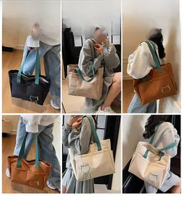 Detail view of stylish canvas tote bags showing four colors with cat print and functional pockets