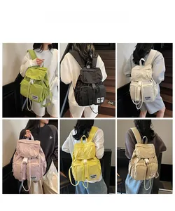 Detailed view of large nylon outdoor backpack in six colors with drawstring and buckles