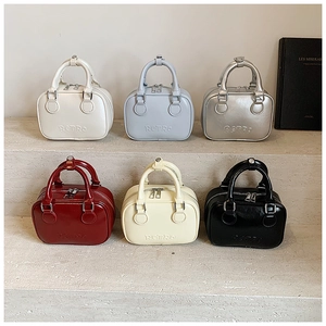 Retro Boston bowling handbags in six colors with embossed text on stone stairs