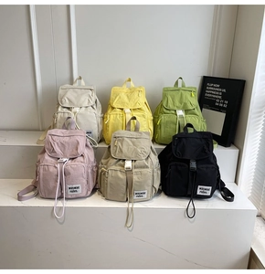 Group display of multiple colors for this nylon travel backpack with multi-pocket details