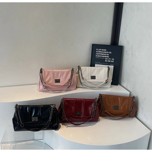 Detailed display of vintage flap tote bags in five colors with metallic chain straps