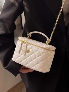Elegant white quilted chain handbag with gold floral accent and leather strap for women