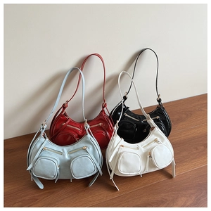 Group display of chic punk leather crescent bags in blue, red, black and white colors
