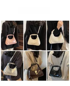 Hobo bag collection in multiple colors shown from the back view on a model