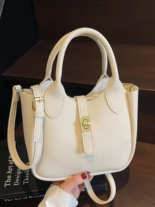 Chic cream lychee texture leather bucket bag with gold hardware and top handle