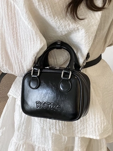 Black glossy PU leather retro Boston bag with embossed letters and adjustable strap