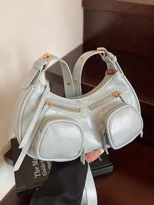 Fashionable light blue punk style crescent underarm bag with glossy finish and pockets