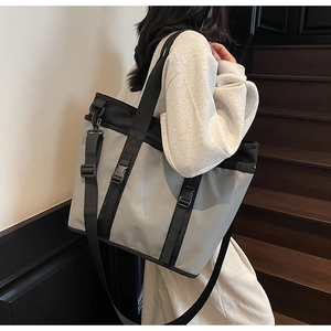 Practical casual messenger tote bag in gray oxford fabric shown from a 45-degree angle