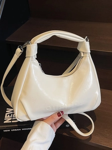 Minimalist cream white half-moon oil wax leather handbag with knotted handle detail