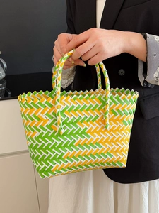 Colorful hand-woven tote bag with green, yellow and white stripes for summer vacation