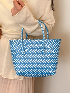 Blue and white chevron woven tote bag for summer beach vacation with dual top handles