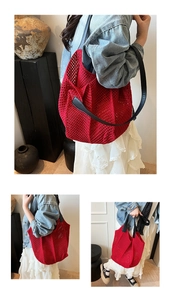 Detailed close-up of red hollow woven tote bag with contrast black faux leather straps