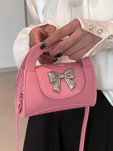 Pink lychee texture mini handbag for women with silver metal bow and crossbody strap