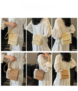 Straw crossbody bag with lace bow detail shown in various carrying styles on model