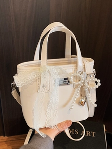 Elegant cream white glossy bucket bag with lace bow and pearl heart charm decor