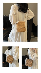 Detail of handmade straw shoulder bag with delicate white lace trim and woven strap