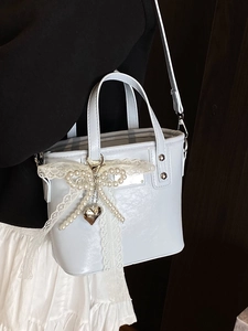 Elegant white mini bucket bag with pearl bow and silver heart charm for women