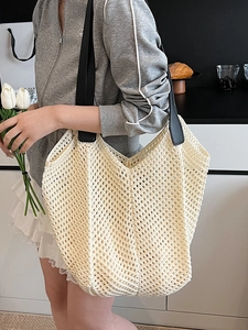 Chic beige hollow crochet tote bag with contrast black leather straps for women