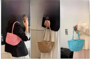 Detail view of woven straw bags with drawstring lining in pink, khaki, and blue