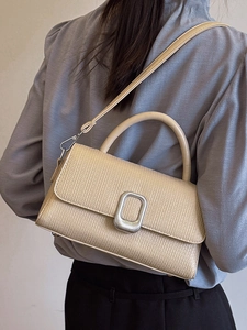 Retro minimalist cream crossbody handbag with textured finish and silver buckle