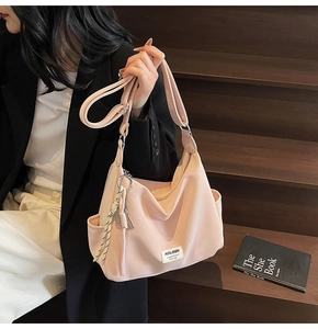 Detailed view of the pink minimalist tote bag with adjustable strap and side pocket