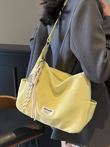 Chic lemon yellow large hobo tote bag with woven charm and side pocket for daily commute