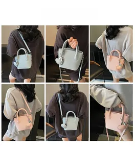 Detailed views of mini lychee texture bucket bag shown as crossbody and handbag