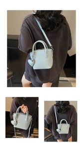Detail of lychee pattern leather bucket bag with heart charm and detachable strap