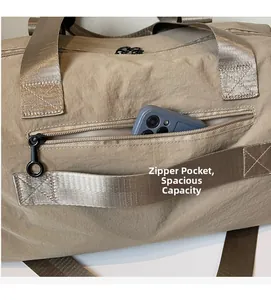 Detail shot of a nylon travel bag side zipper pocket showing ample storage space