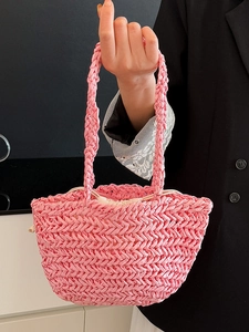 Pink woven straw tote bag with drawstring lining for summer beach vacation style