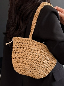Minimalist straw bucket bag with drawstring closure for casual summer vacation shoulder wear