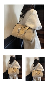 Detailed view of khaki canvas duffel bag featuring shoe compartment and woven shoulder strap