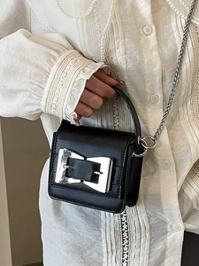 Mini black leather crossbody bag with silver bow buckle and chain strap for women