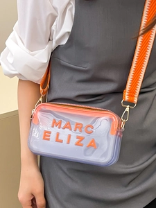 Sac bandoulière transparent avec sangle orange et inscription design Marc Eliza