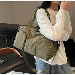 Olive green travel bag with separate shoe compartment and water resistant nylon fabric