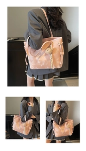 Pink marbled tote bag detail with drawstring closure and cute plush bear charm