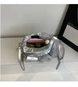 Top view of metallic silver tote bag interior showing spacious storage for cosmetics