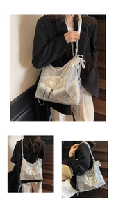 Detailed views of a metallic silver hobo bag with lace bow and pearl charm accessories